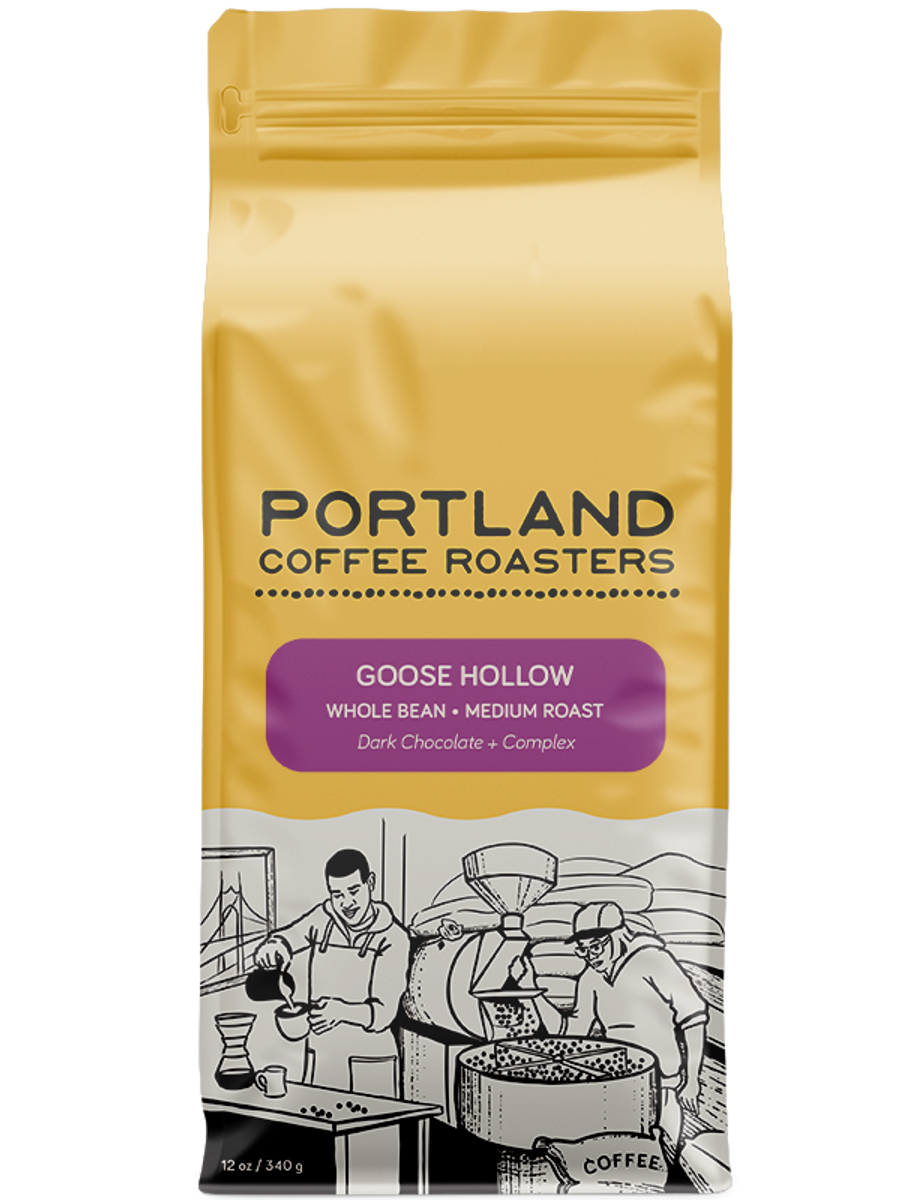 A package of Portland Coffee Roasters' Goose Hollow whole bean coffee, medium roast. purple label on yellow bag reads dark chocolate and complex
