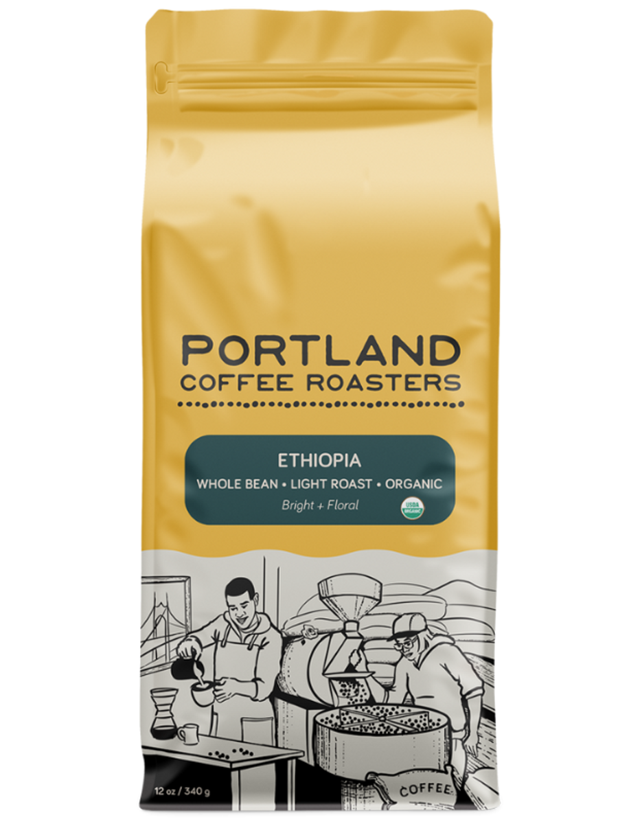 Coffee bag from Portland Coffee Roasters with a yellow background and black text. green label reads ethiopia, whole bean, light roast, organic, bright and floral