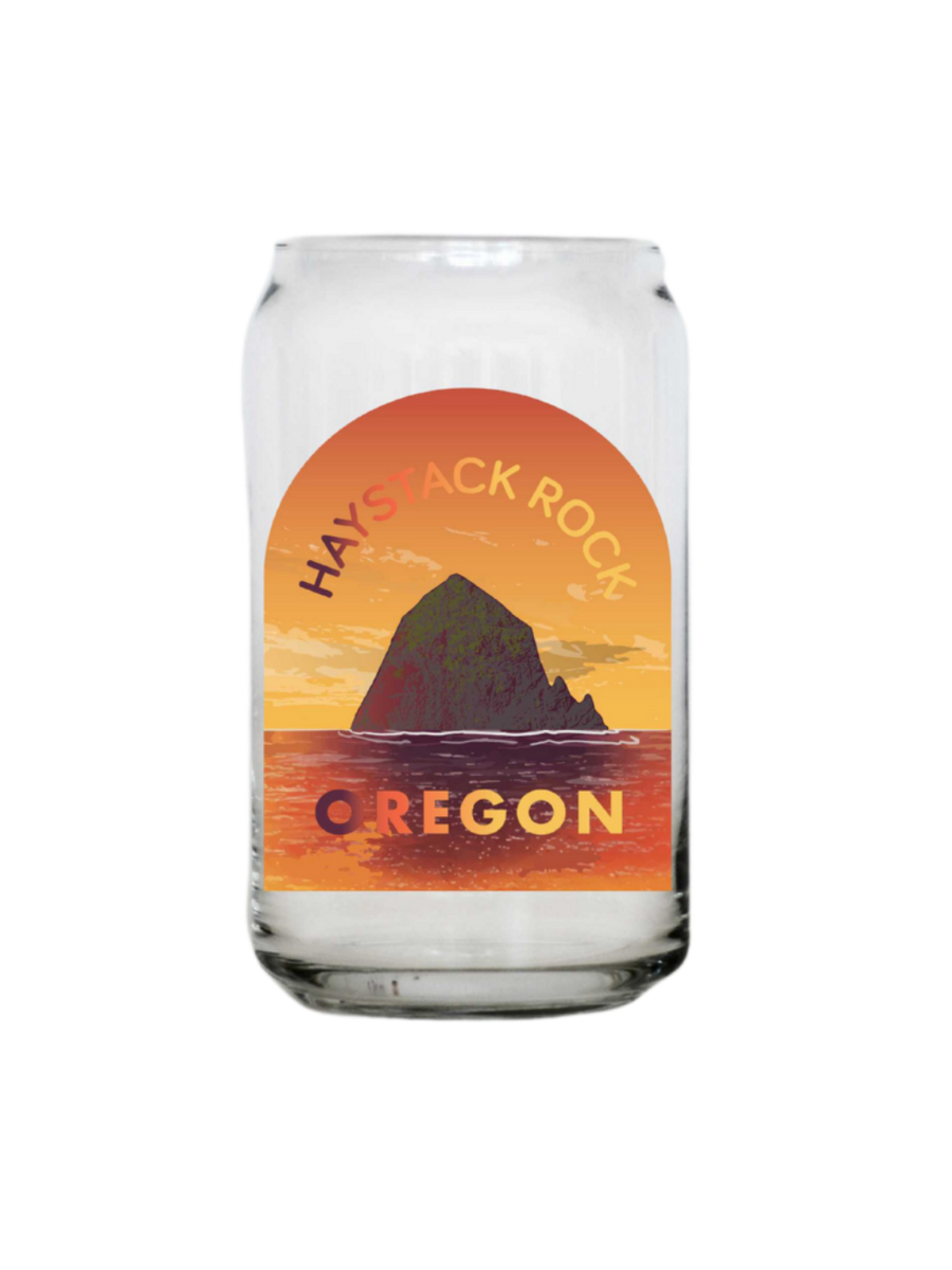 Glass tumbler with Haystack Rock Oregon design on a white background