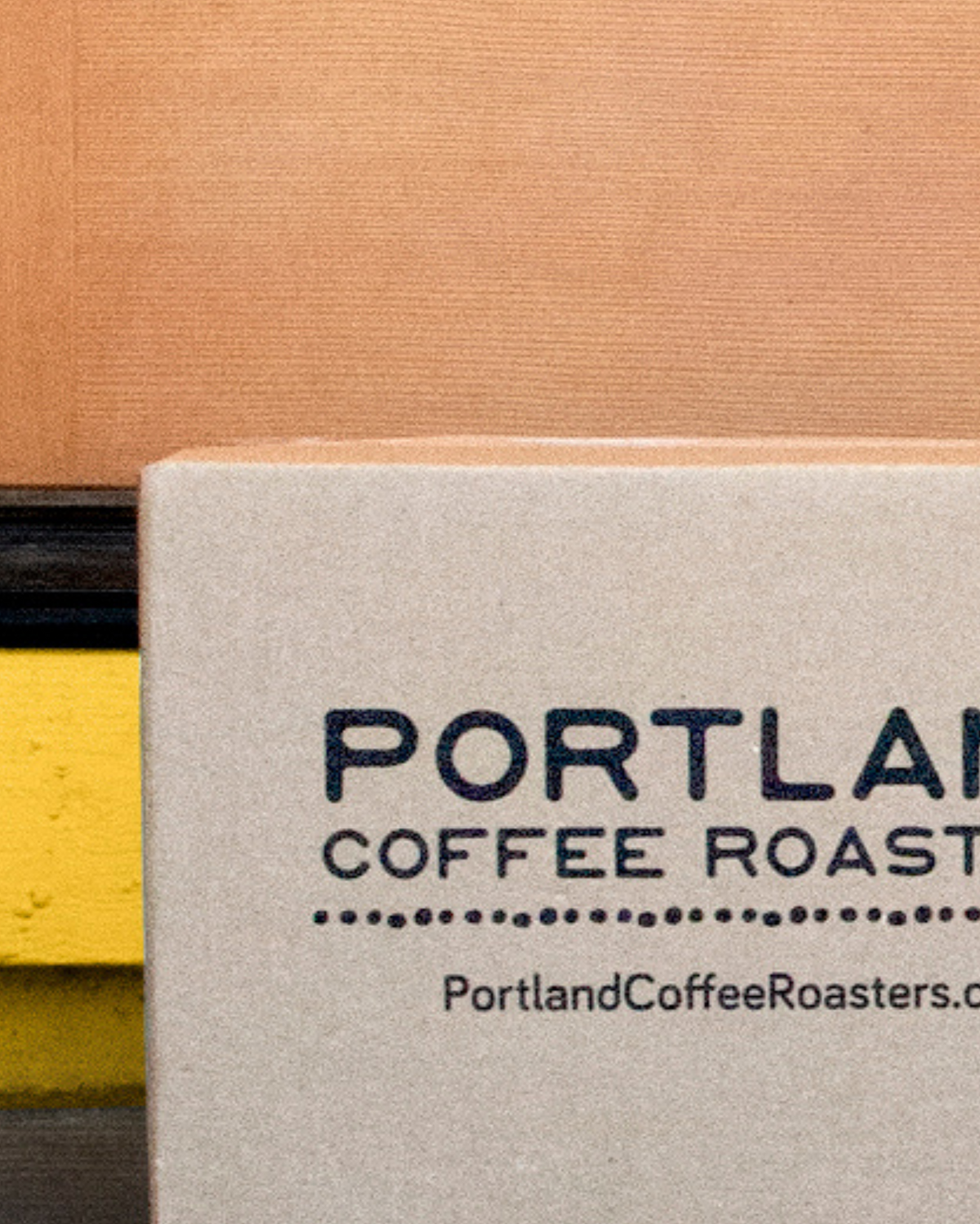 Portland Coffee Roasters branded box on a colorful background