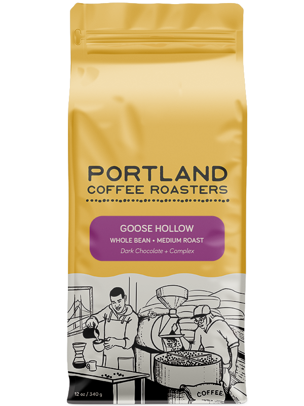 A package of Portland Coffee Roasters' Goose Hollow whole bean coffee, medium roast. purple label on yellow bag reads dark chocolate and complex
